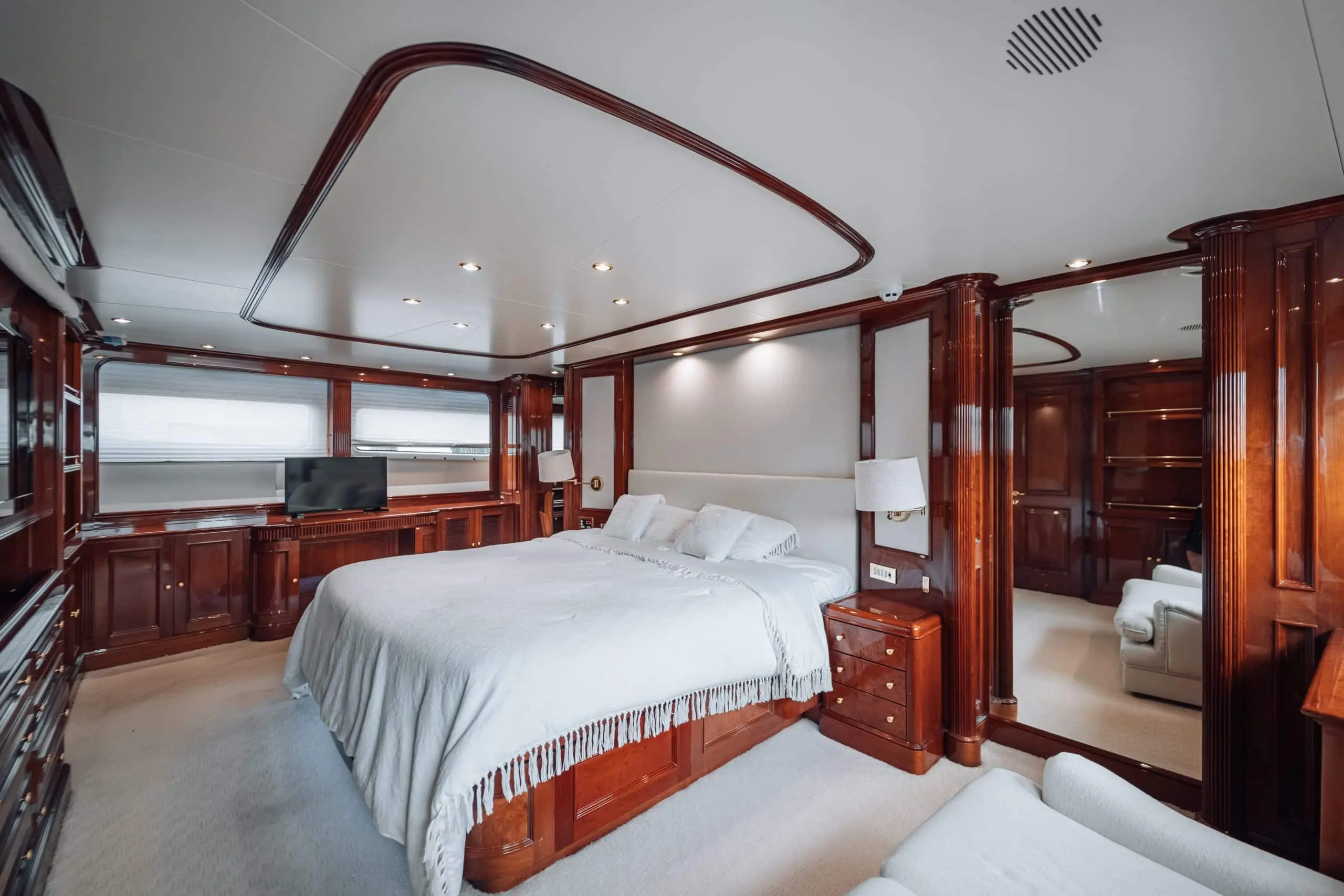 Royal Mirage yacht interior cabin with curved ceiling design and wooden finish