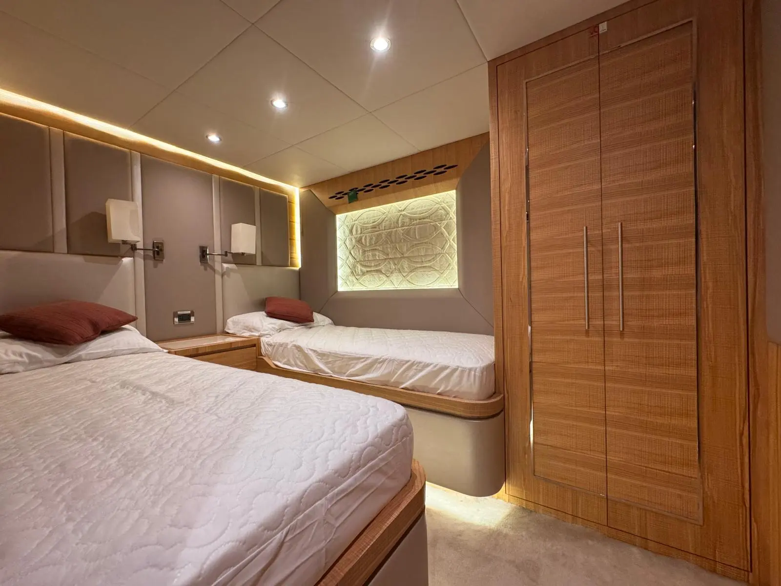 Nomad 65 twin guest cabin wardrobe and backlit hull window