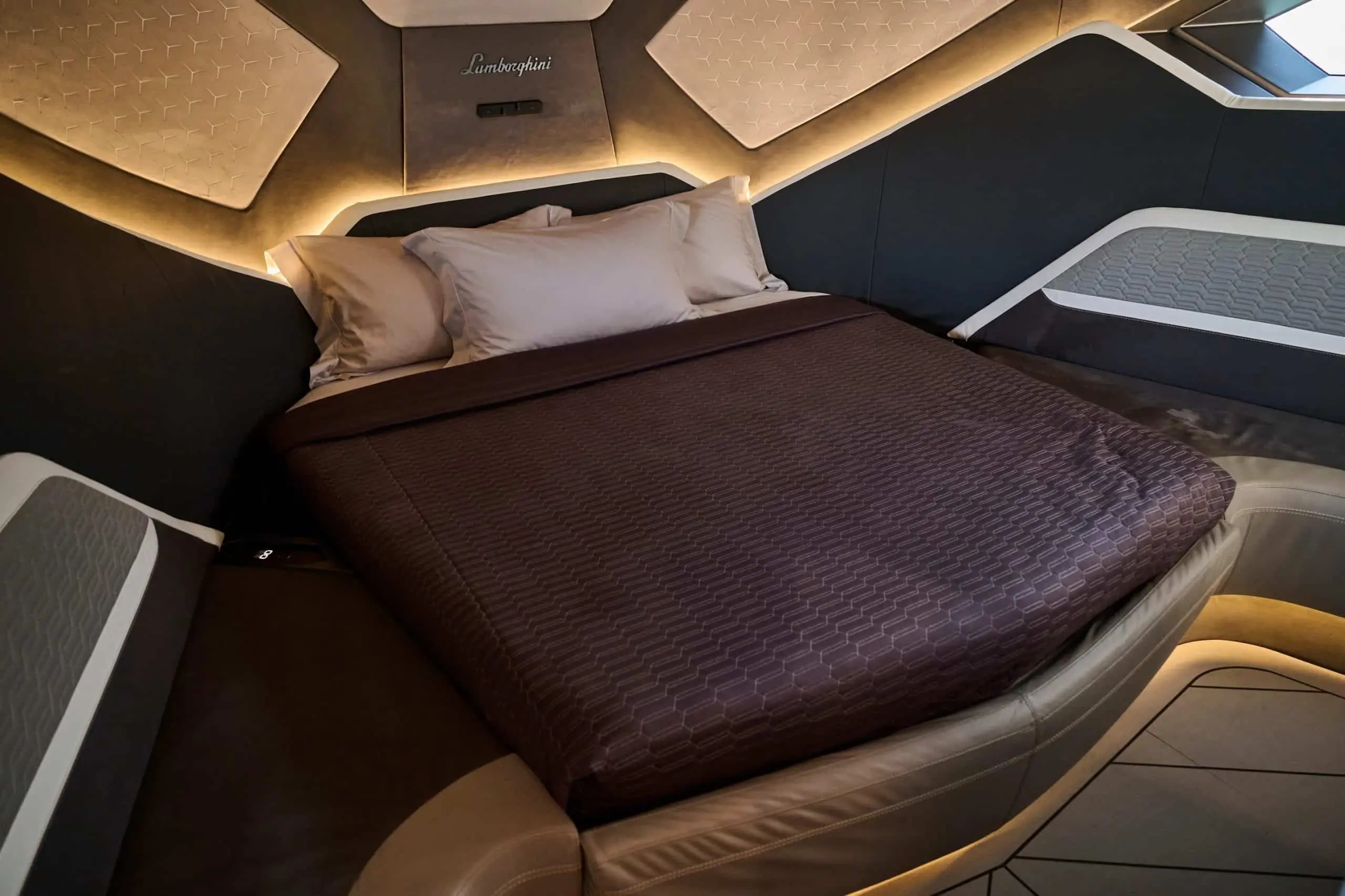 Lamborghini 63 yacht luxury cabin bed with leather headboard and ambient lighting