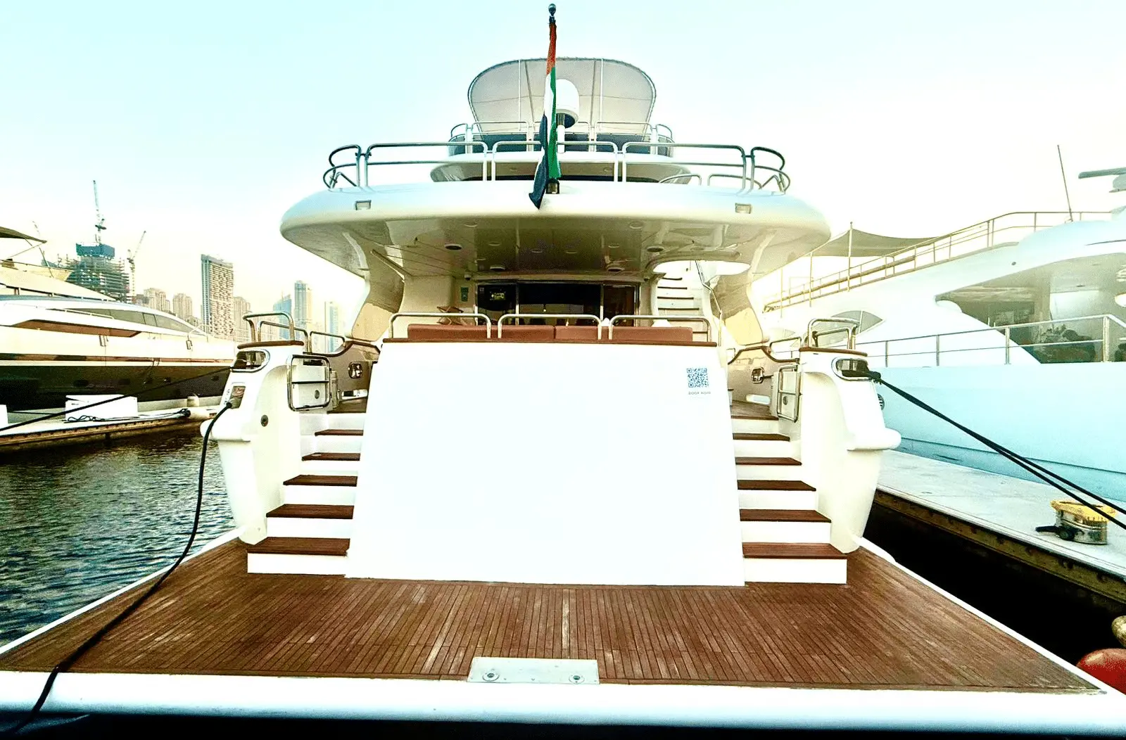Benetti 120 aft deck with teak flooring and stair access to upper deck