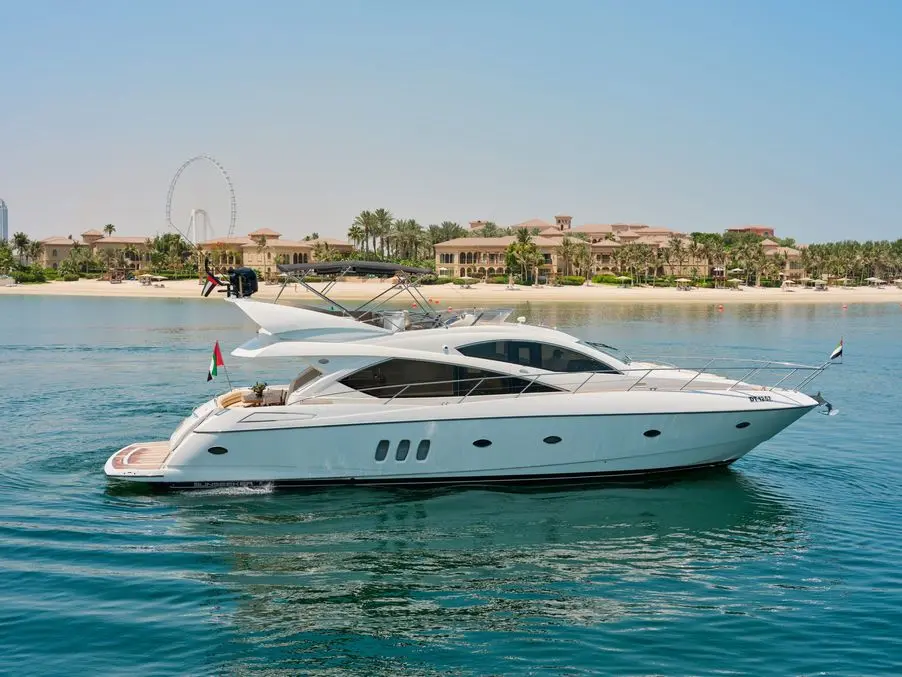 Sunseeker Satoshi 70 at anchor on calm water in Dubai