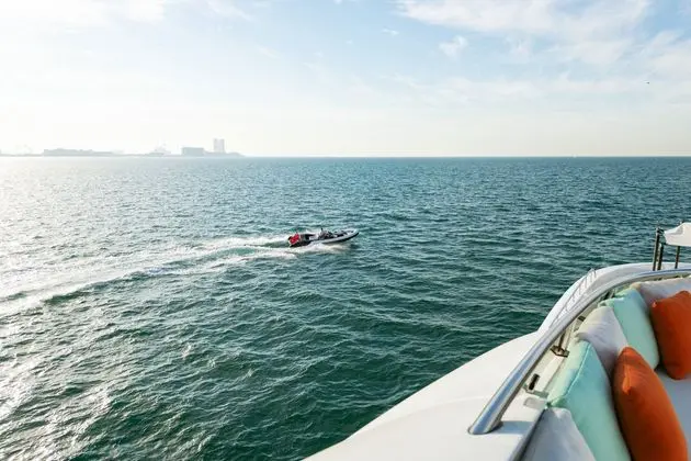Heesen 5000 deck view with chase tender running alongside