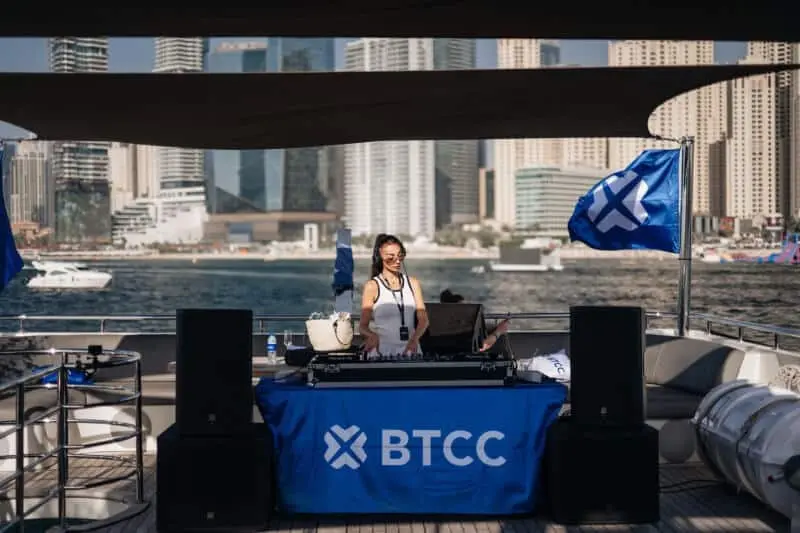 Corporate yacht lounge area with branded signage and luxury seating in Dubai