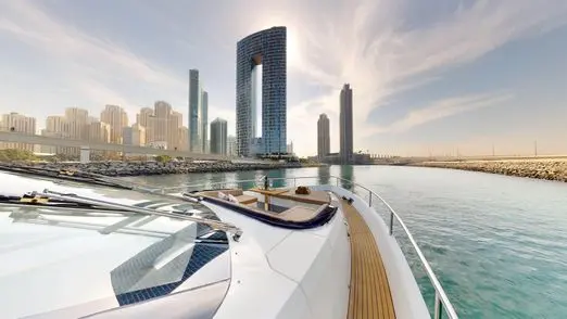 Galeon 780 F1 luxury yacht front deck with city skyline view