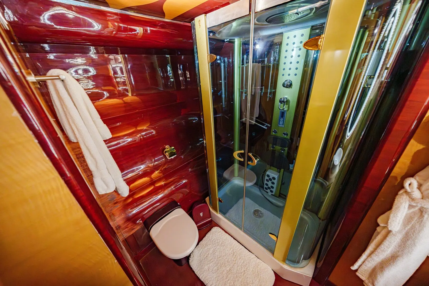 Thunder Superyacht bathroom with glass shower cabin and wooden walls