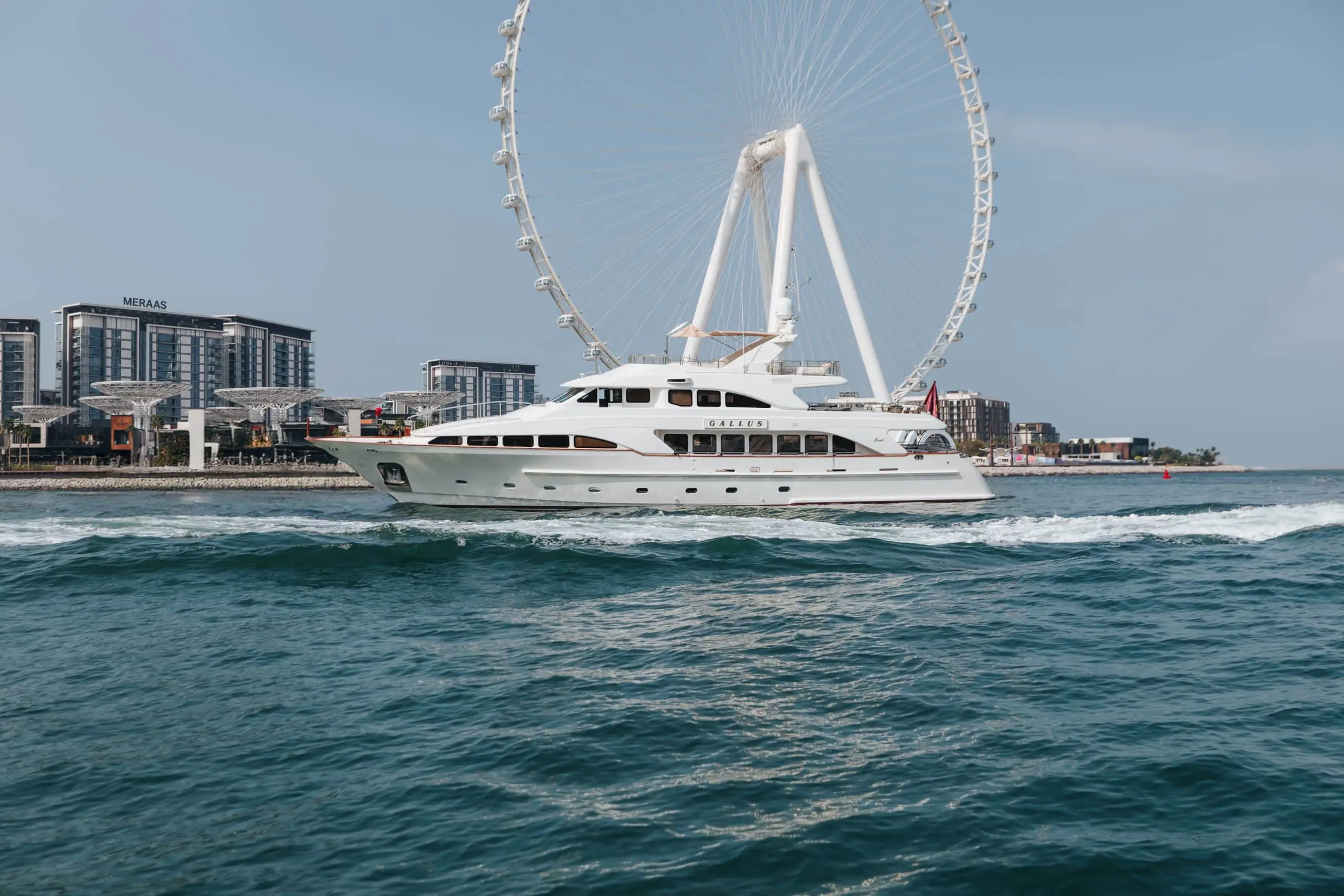 Luxury yacht cruising near Ain Dubai on the waters of Dubai.