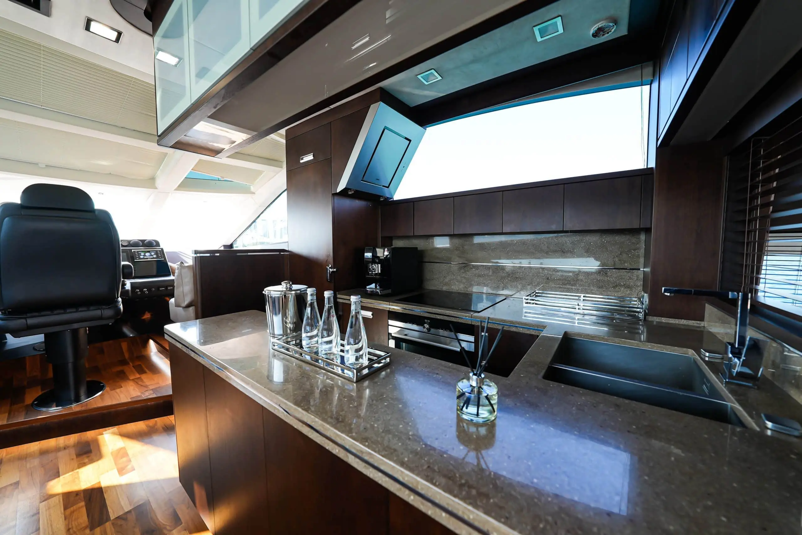Galeon 780 F1 yacht galley with modern countertops and skylight windows