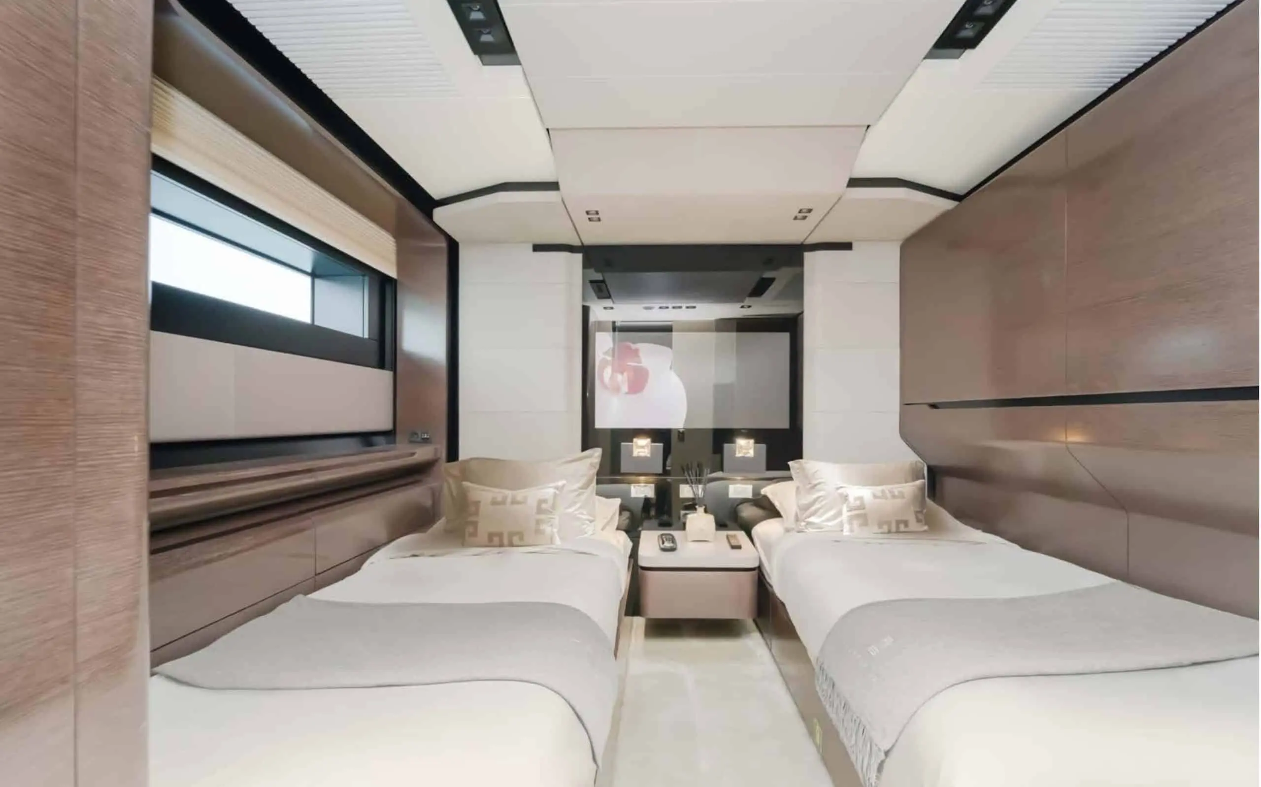 Saffuriya VIP yacht private lounge cabin with plush sofas, modern décor and panoramic window views
