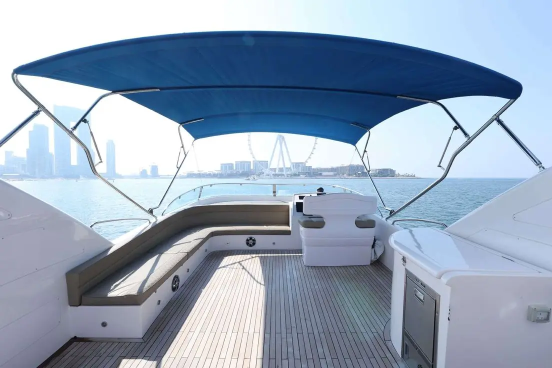 Belle 75 yacht flybridge with seating and sea view.
