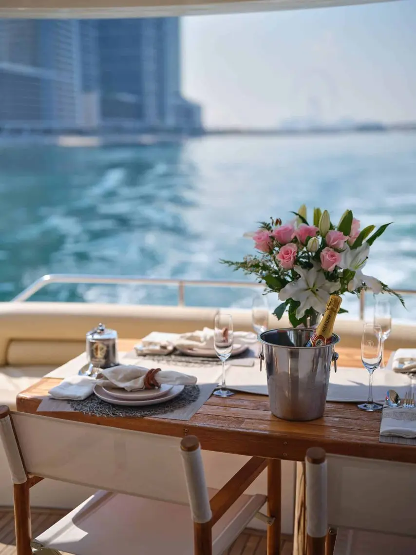 luxury yacht dining setup with ocean view and catering table arrangement
