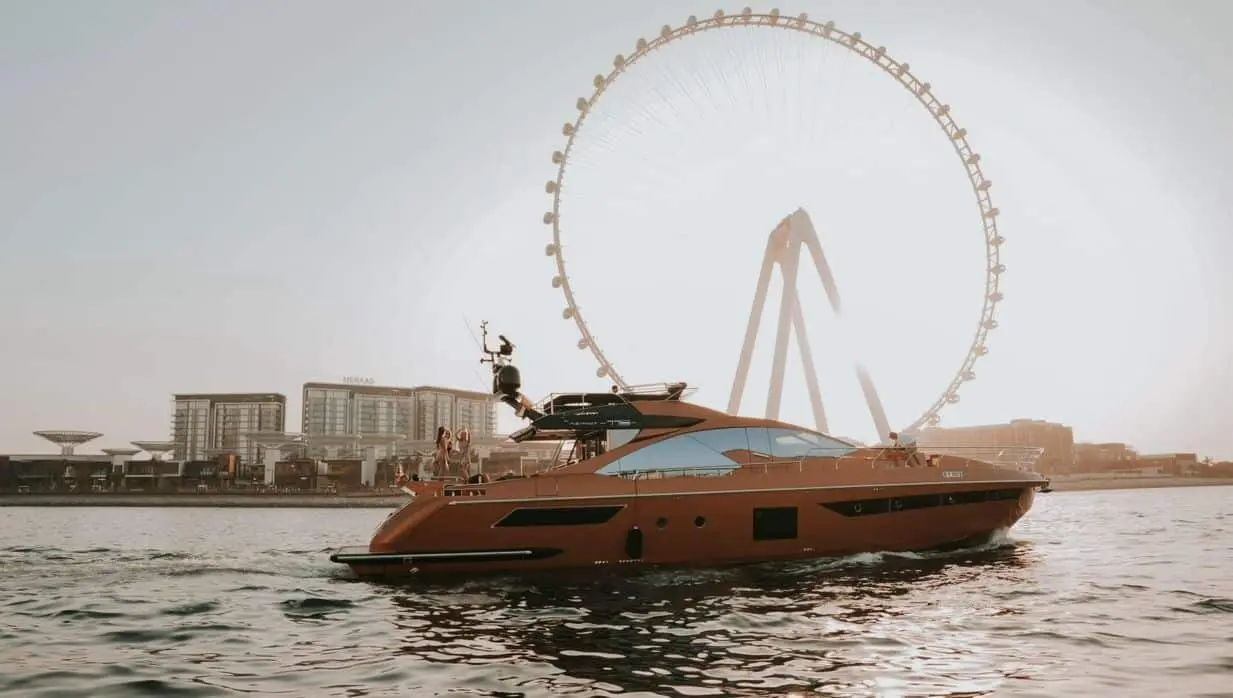 Azimut 77 luxury yacht cruising near Ain Dubai at sunset