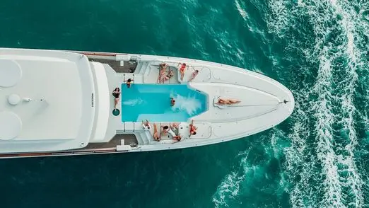Thunder Superyacht aerial view showing deck pool in turquoise Dubai waters