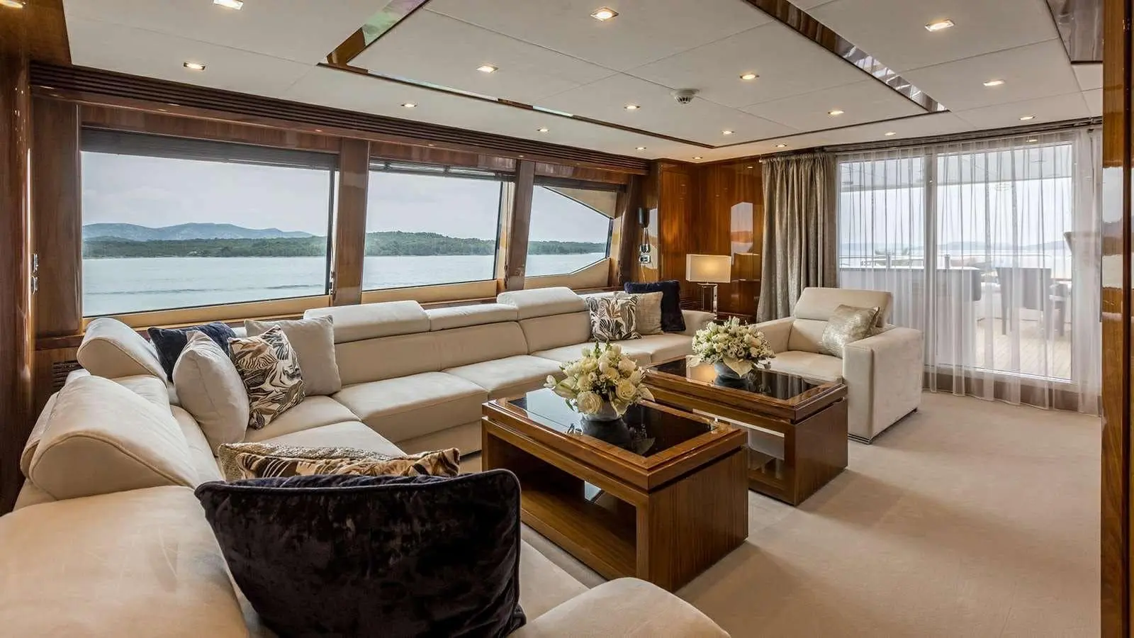 Sunseeker 37M sky lounge seating with coffee table, sea view
