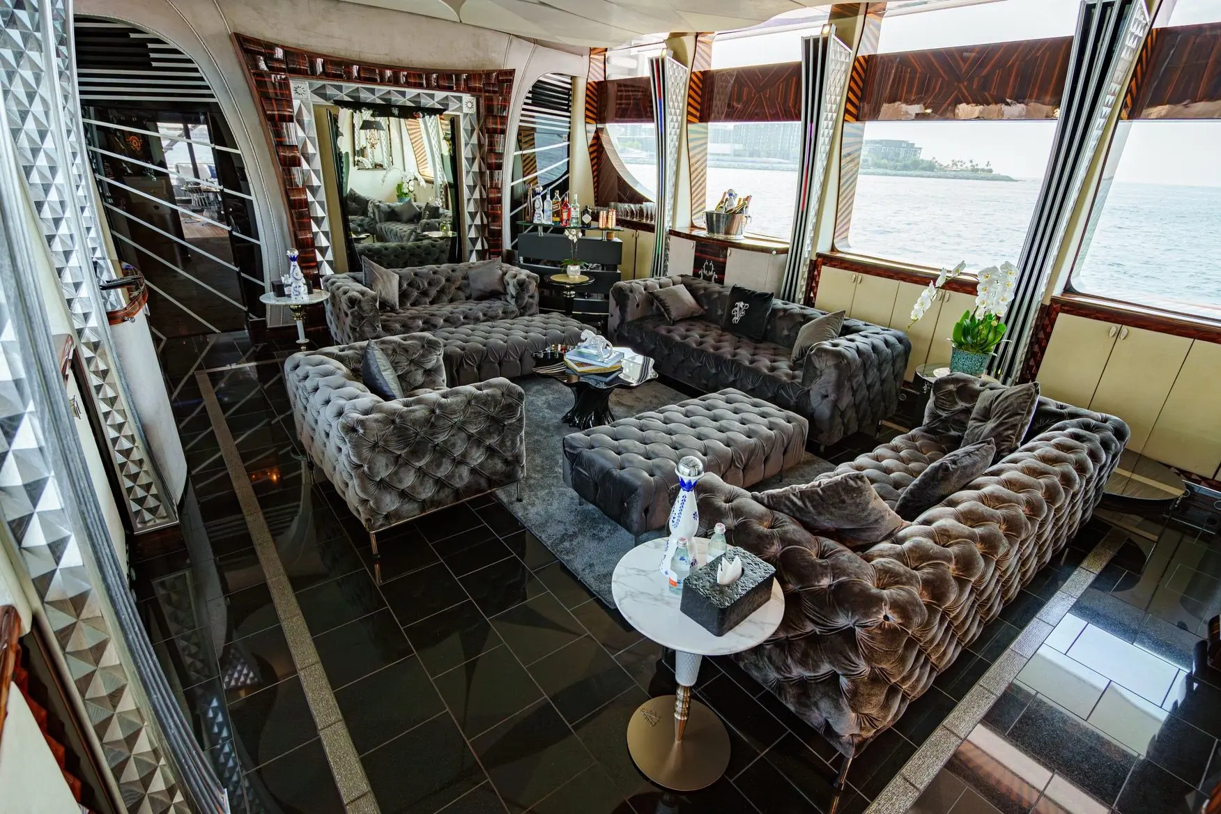 Thunder Superyacht indoor lounge with luxury sofas and panoramic windows
