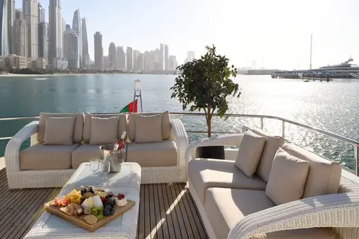 Private yacht outdoor lounge with Dubai Marina skyline view