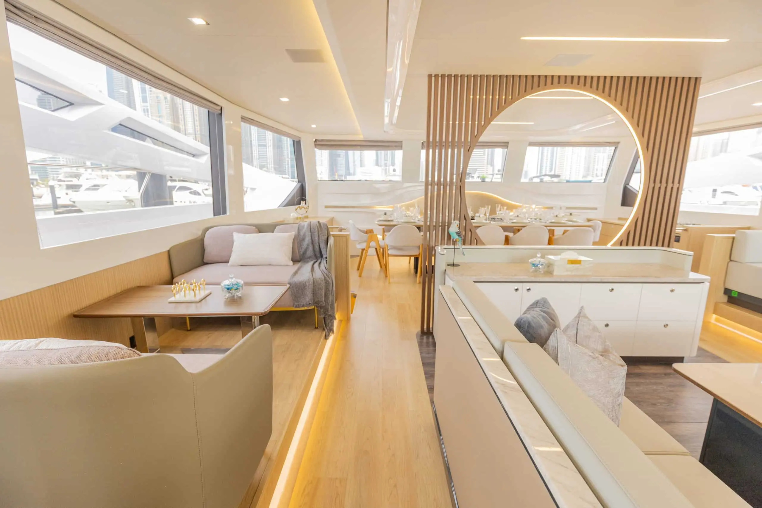Zirve 72 yacht luxury living space with wooden accents and large side windows