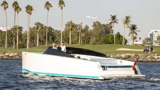 Von Dutch 40 yacht near Dubai waterfront and palm trees