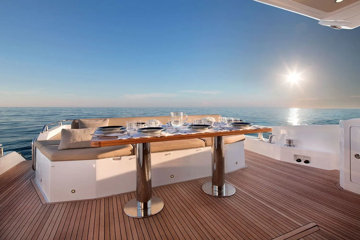Azimut 77S cockpit dining table set at sunset — shipyard photo