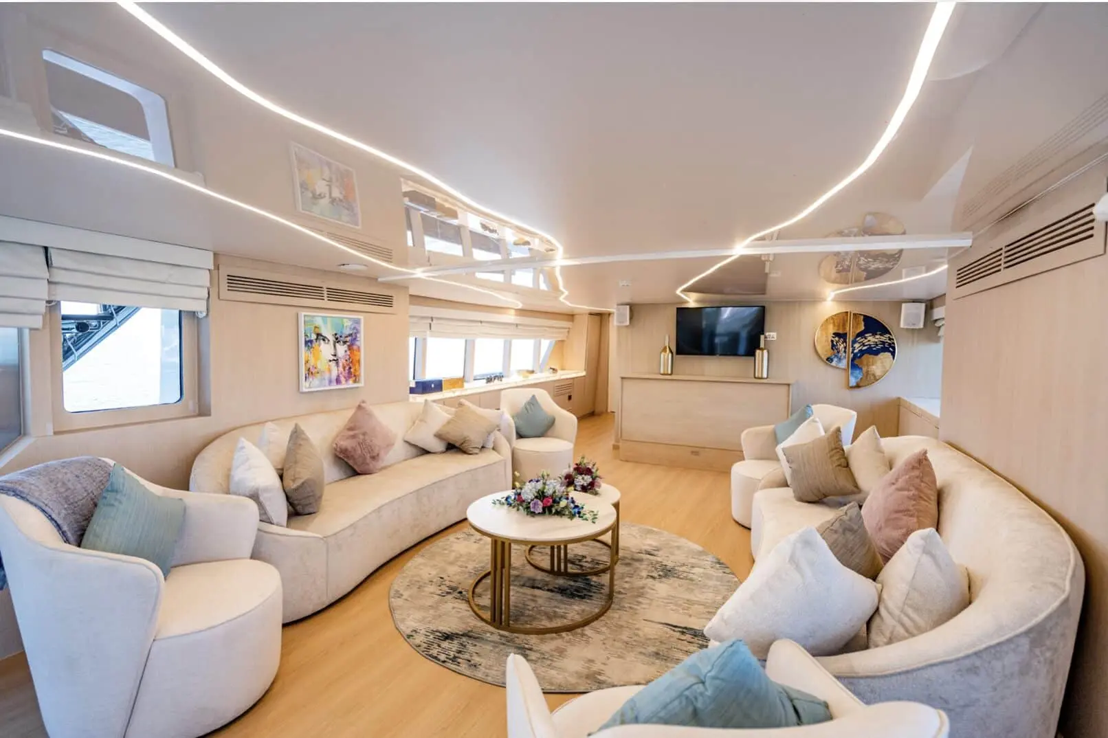 Luxury yacht indoor lounge with circular seating on Finesse yacht Dubai