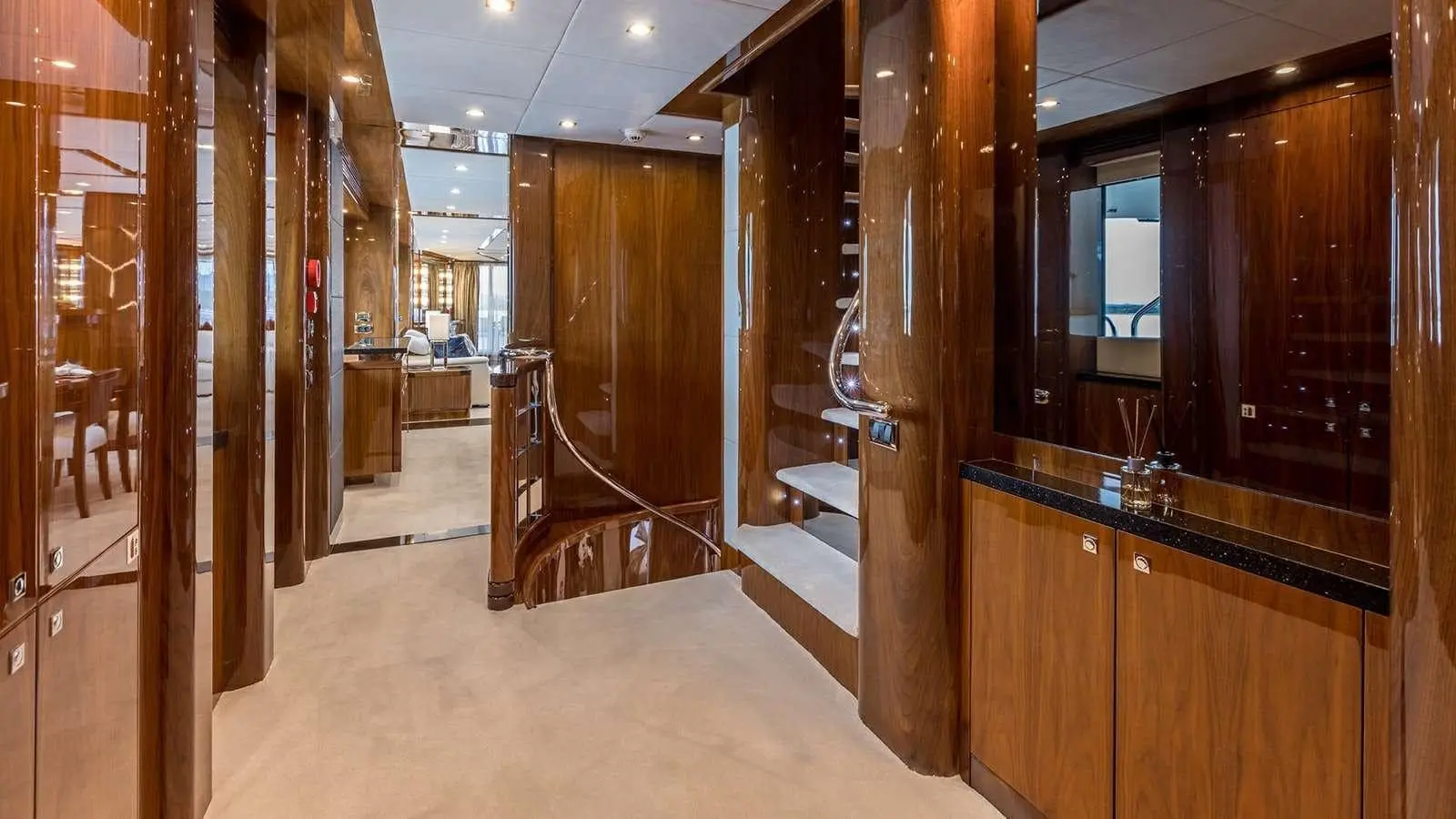 Sunseeker 37M guest lobby with curved staircase, gloss walnut