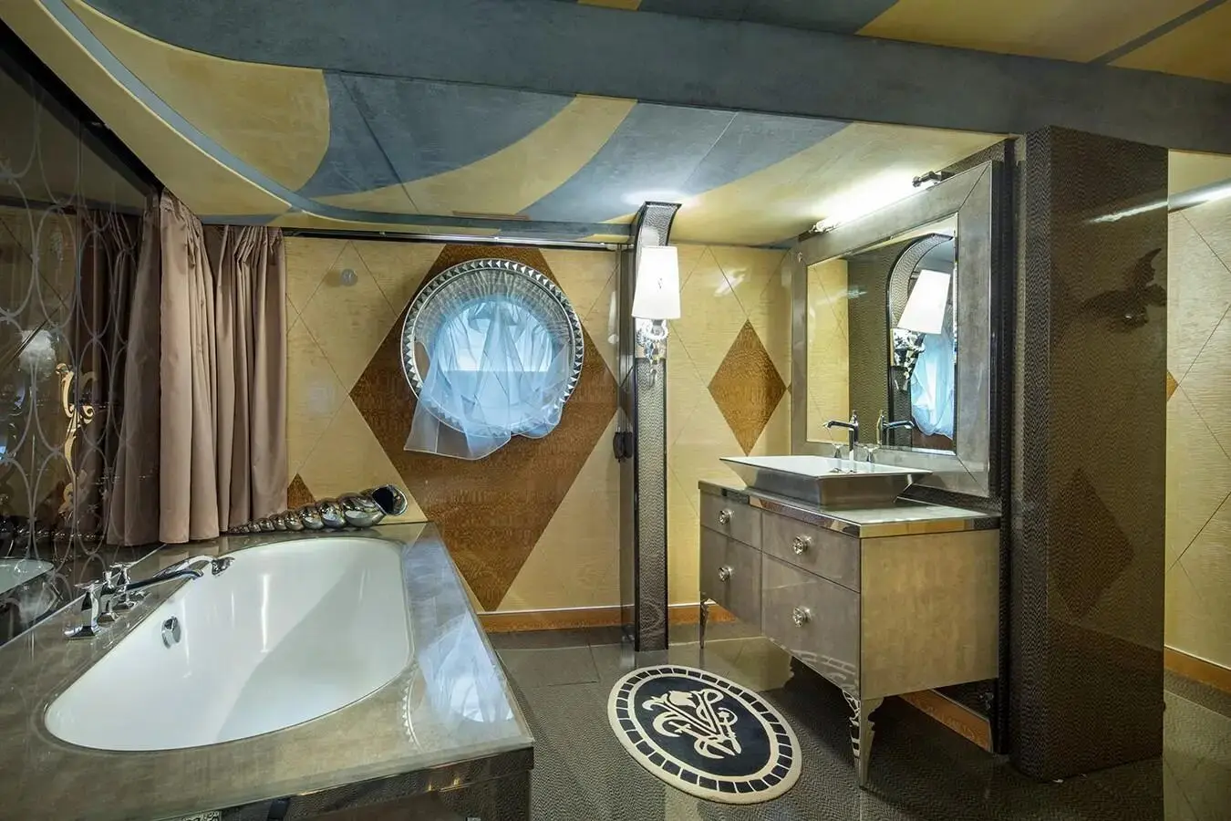 Thunder Superyacht luxury bathroom with marble sink and round porthole window