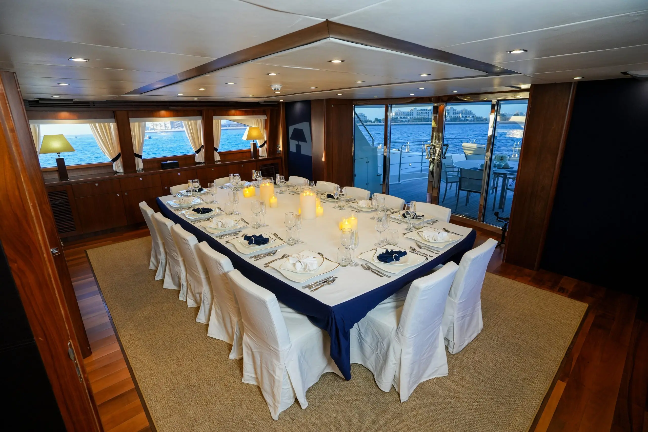 Elegant interior dining room on Sunseeker 131 yacht with formal table setting