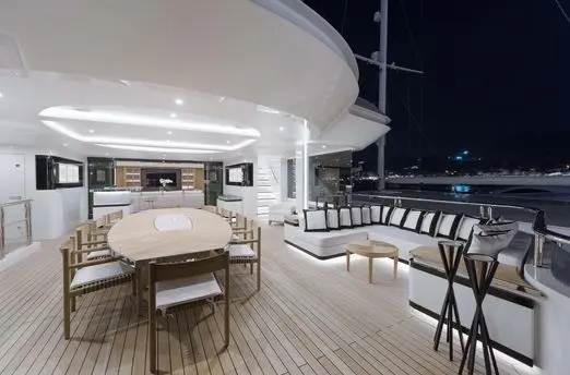 Skyfall 177 yacht outdoor dining area with sea view and modern seating