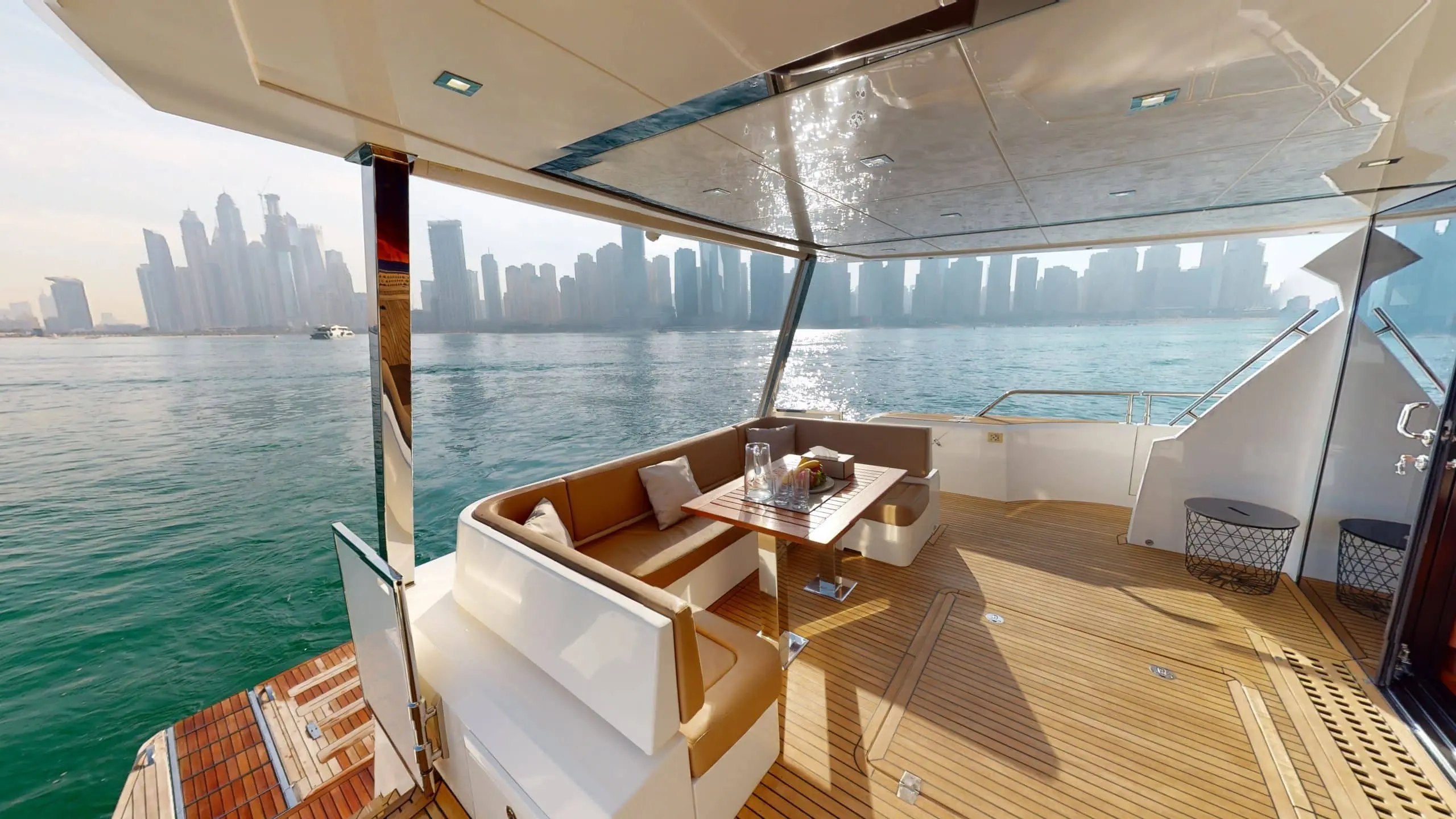Galeon 780 F1 yacht outdoor dining area with sea view and luxury seating