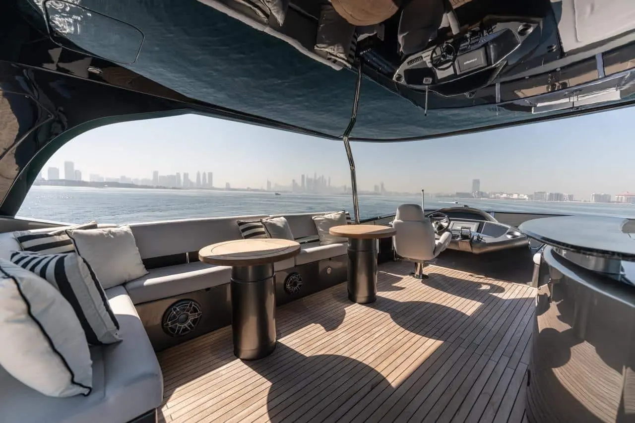 Sunseeker 82 Yacht flybridge lounge with twin dining tables