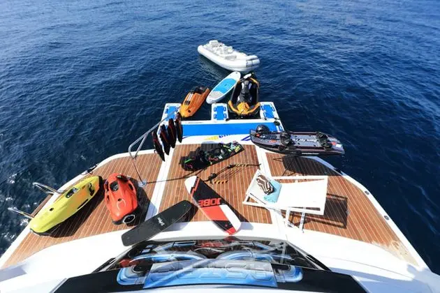 Baia 100 aerial view of swim platform with jet skis and tender