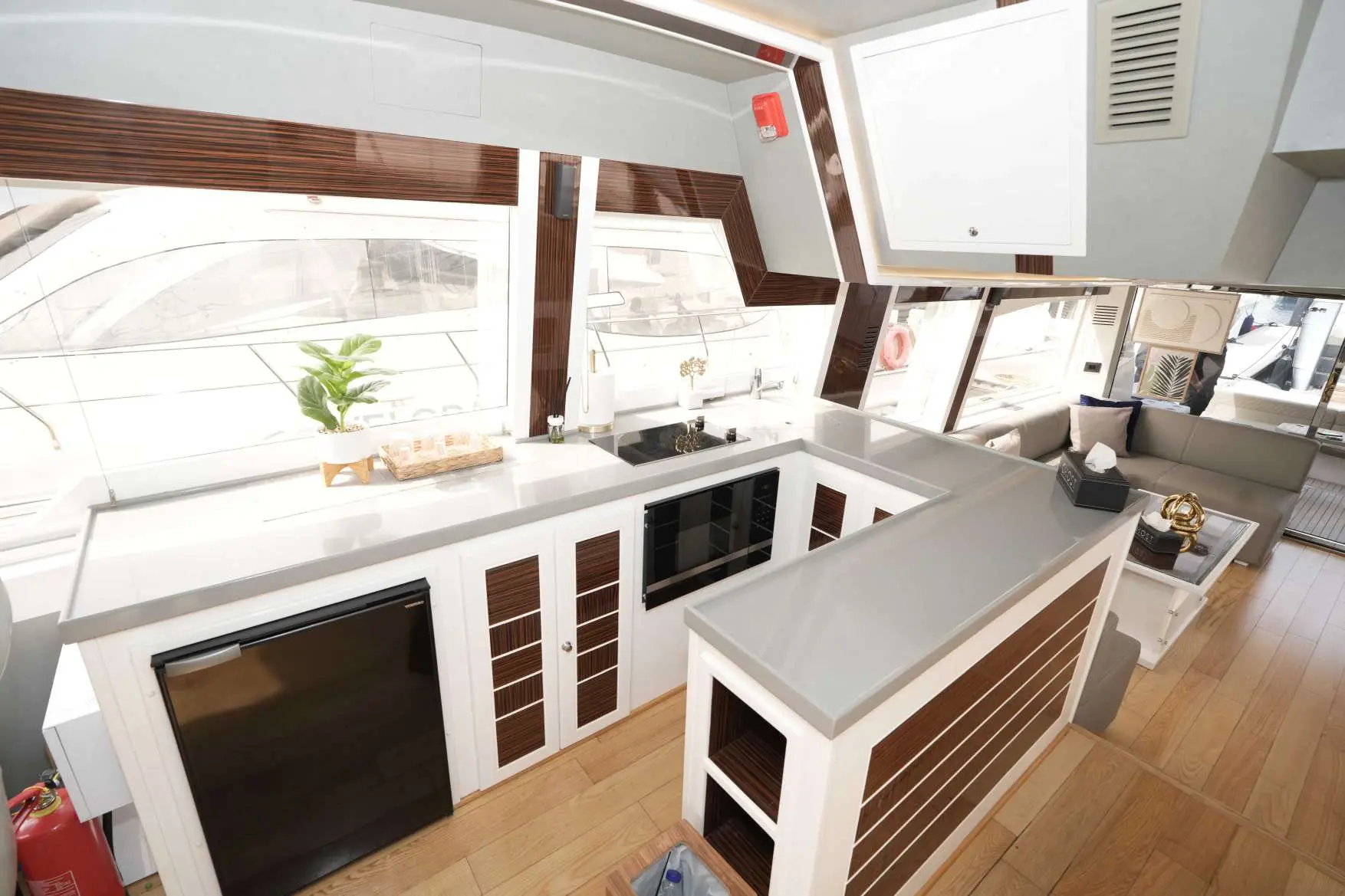 Belle 75 yacht galley with modern kitchen design.