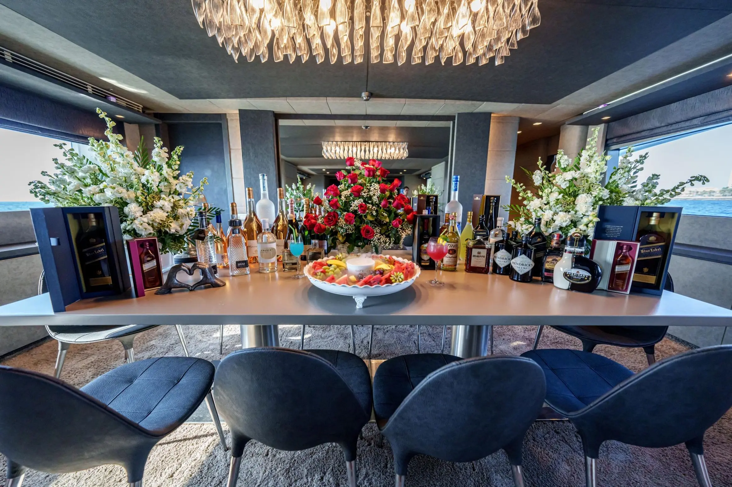 Elegant yacht interior dining area with floral centerpiece on Tatti 110