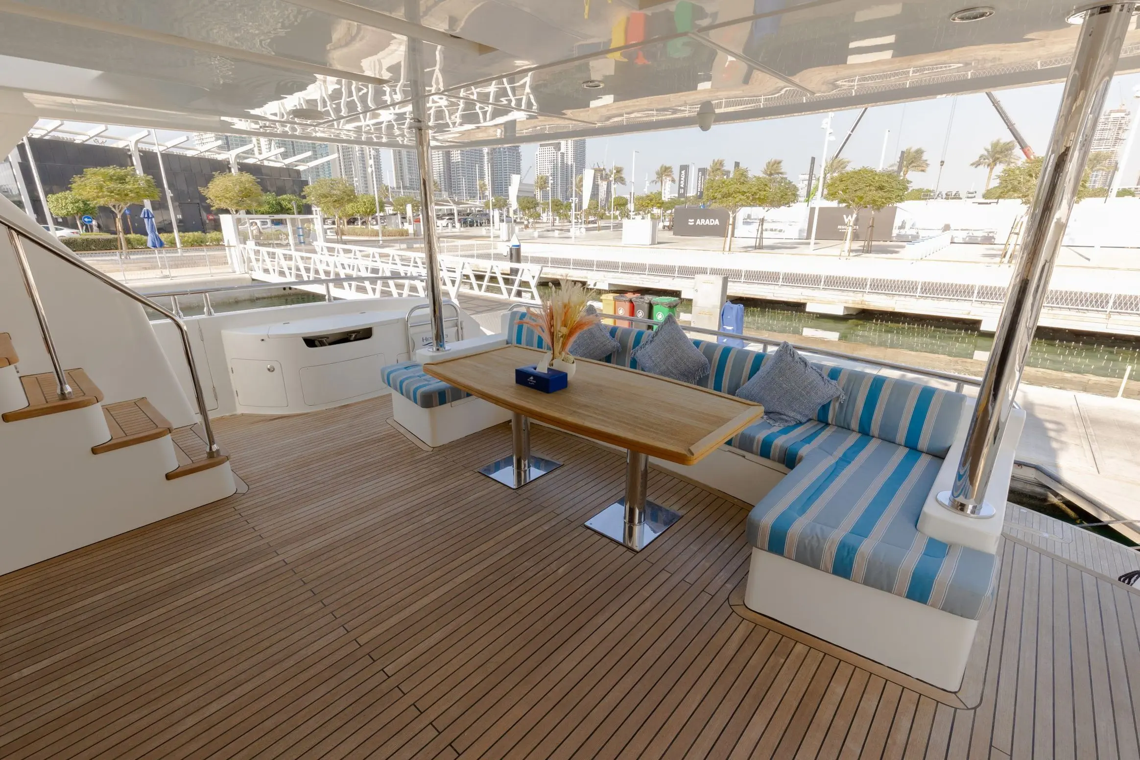 Cante 97 yacht aft deck seating area with wooden flooring