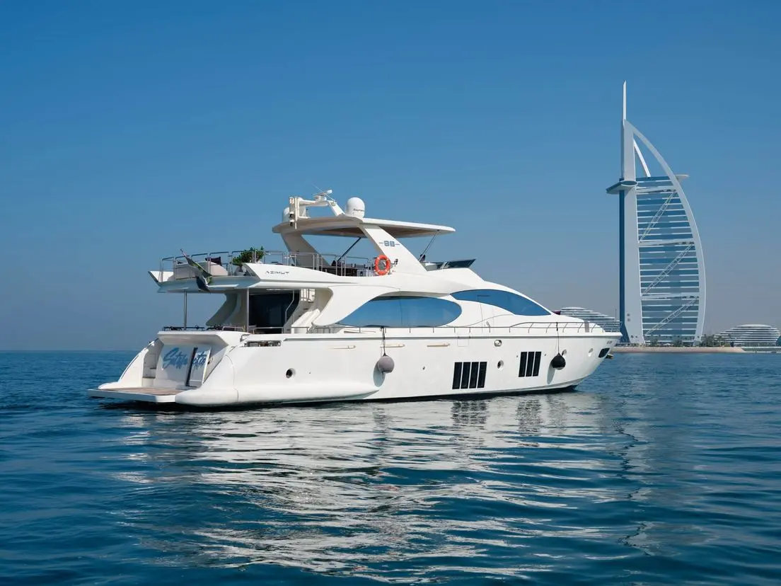 Azimut 88 yacht sailing near Dubai Marina skyline