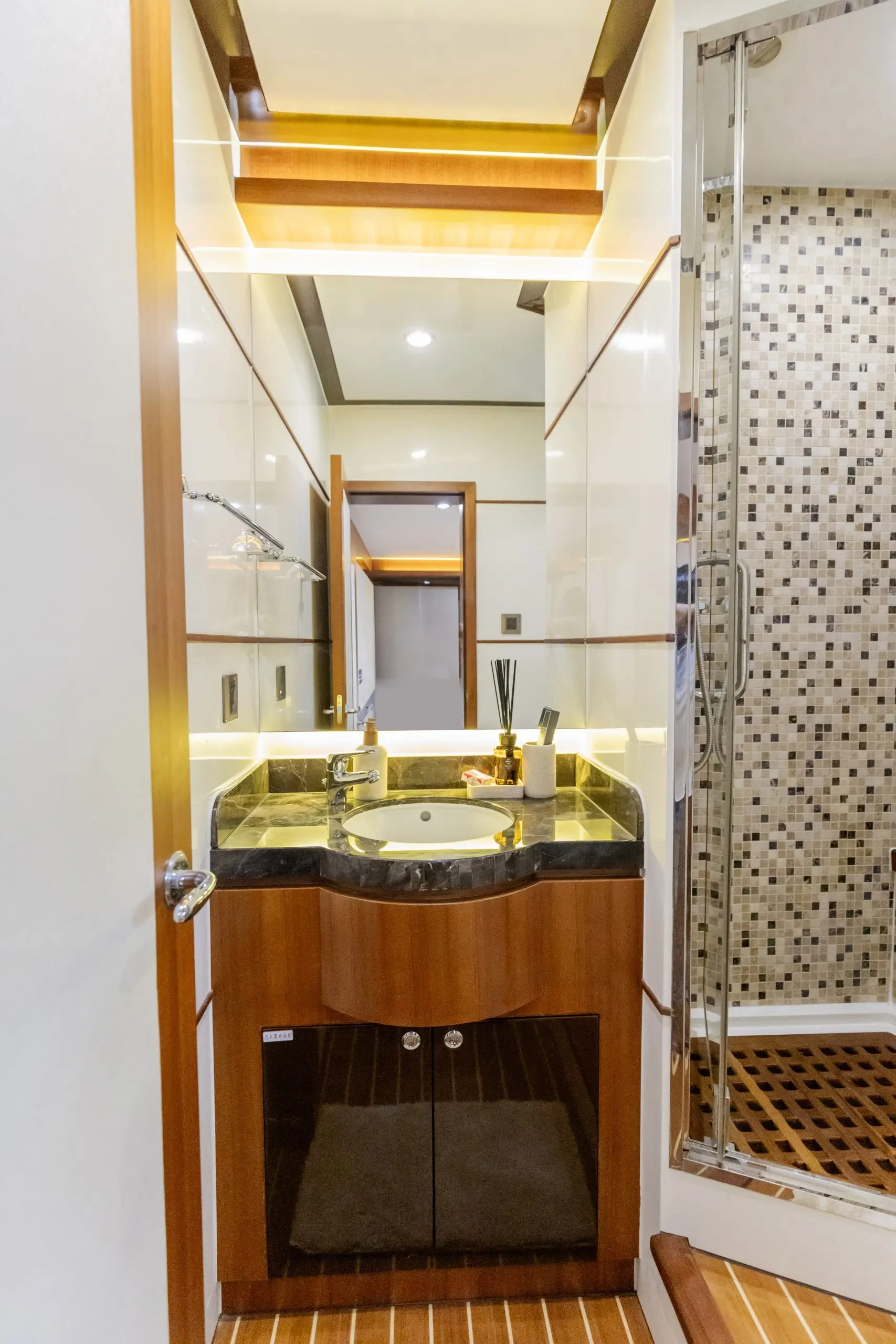Cante 97 yacht shower room with tiled wall and glass door