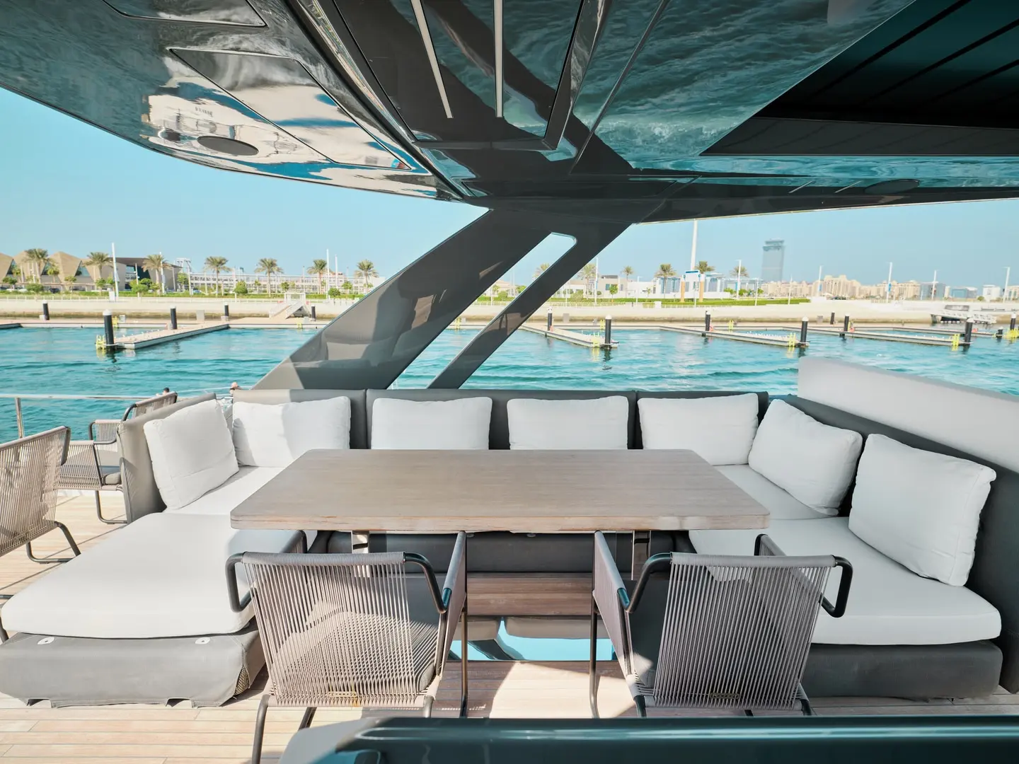 Flybridge dining area on Ferretti 780 yacht with sea views