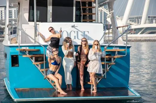 Friends enjoying a party onboard Zenith 64 yacht in Dubai