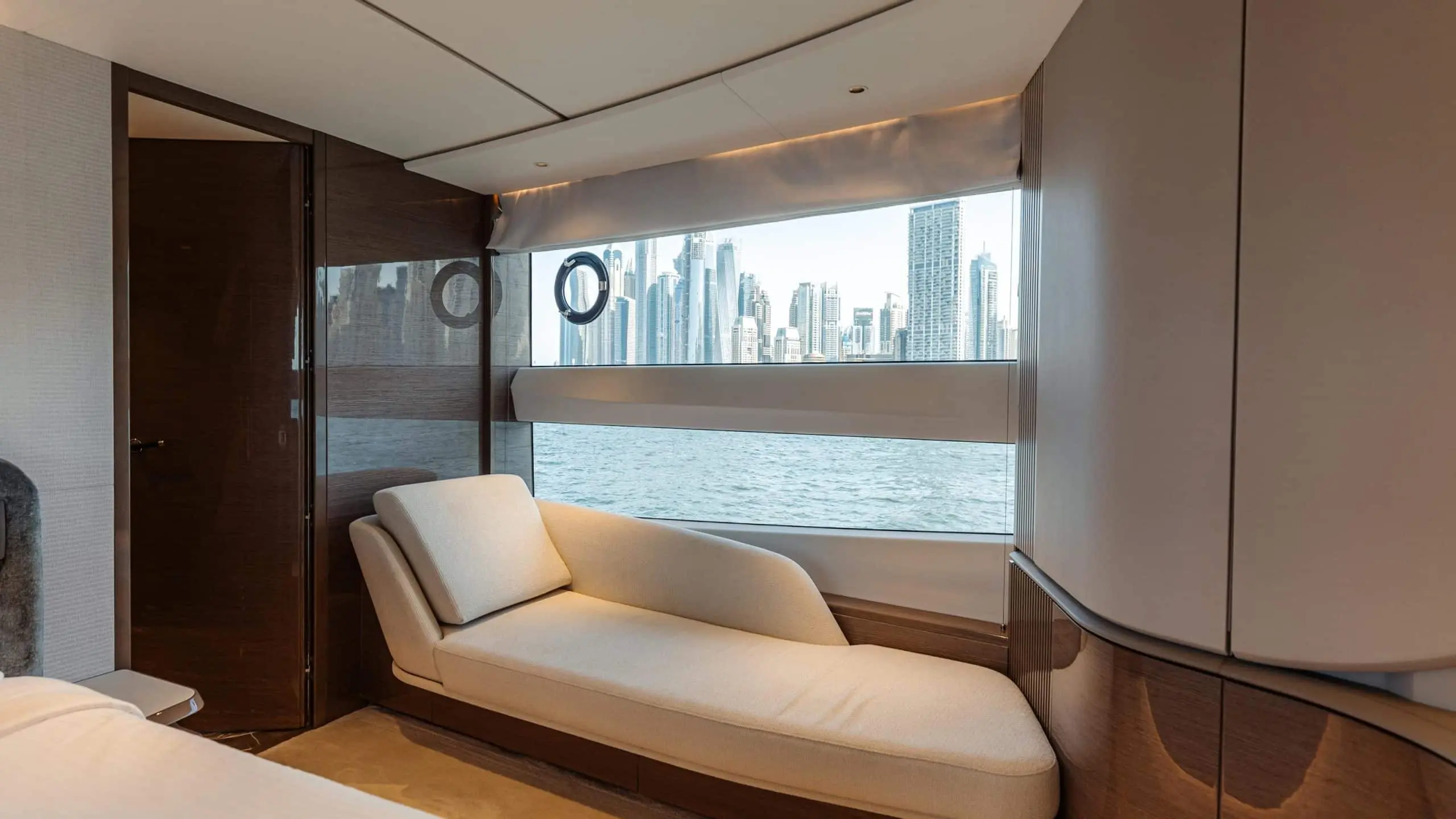 Princess X95 lounge chaise beside panoramic window