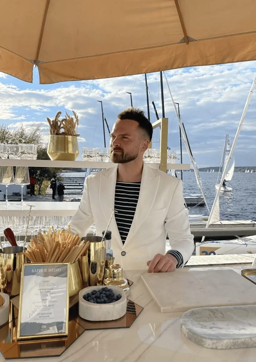 luxury yacht bartender preparing drinks at onboard bar station