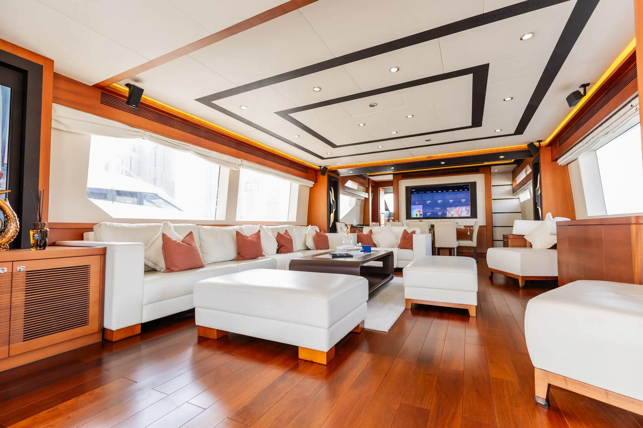 Cante 97 yacht main salon with white sofas and large windows