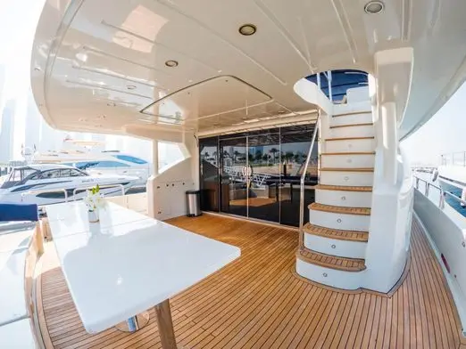 Asya 110 yacht interior dining area with staircase and wooden flooring