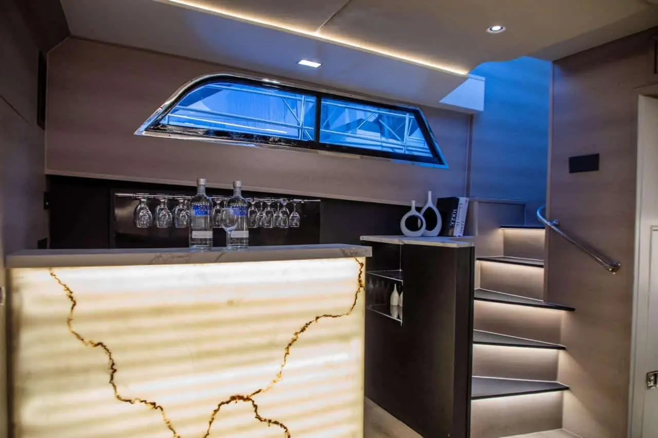 Outdoor deck seating area of Zenith 64 yacht at sunset