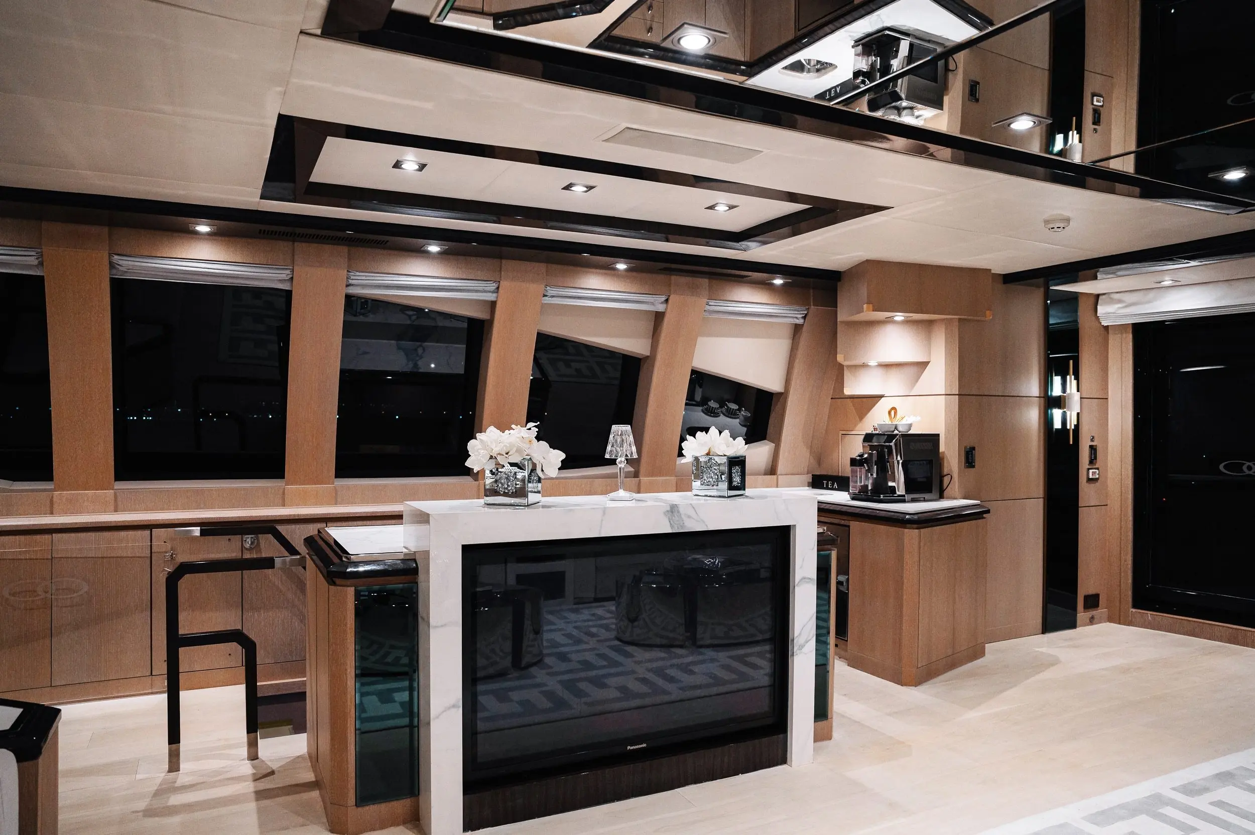Luxury bar and dining area inside Royalty 136 yacht