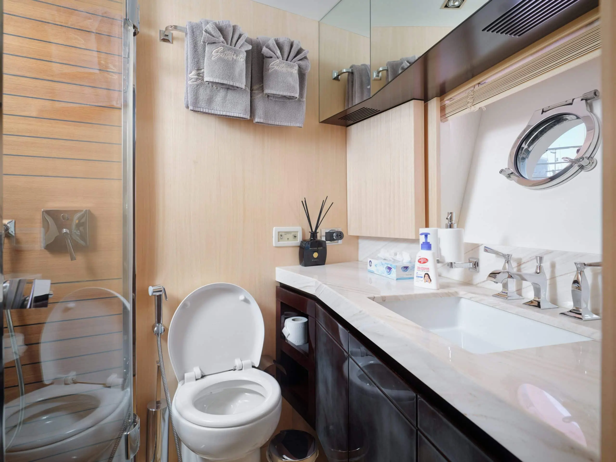 Luxury bathroom with sink and mirror inside Azimut 88 yacht