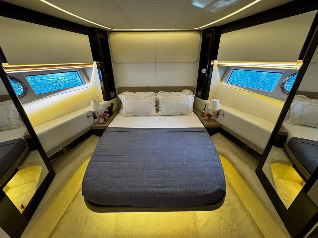 Azimut 77 yacht master cabin with modern double bed and ambient lighting