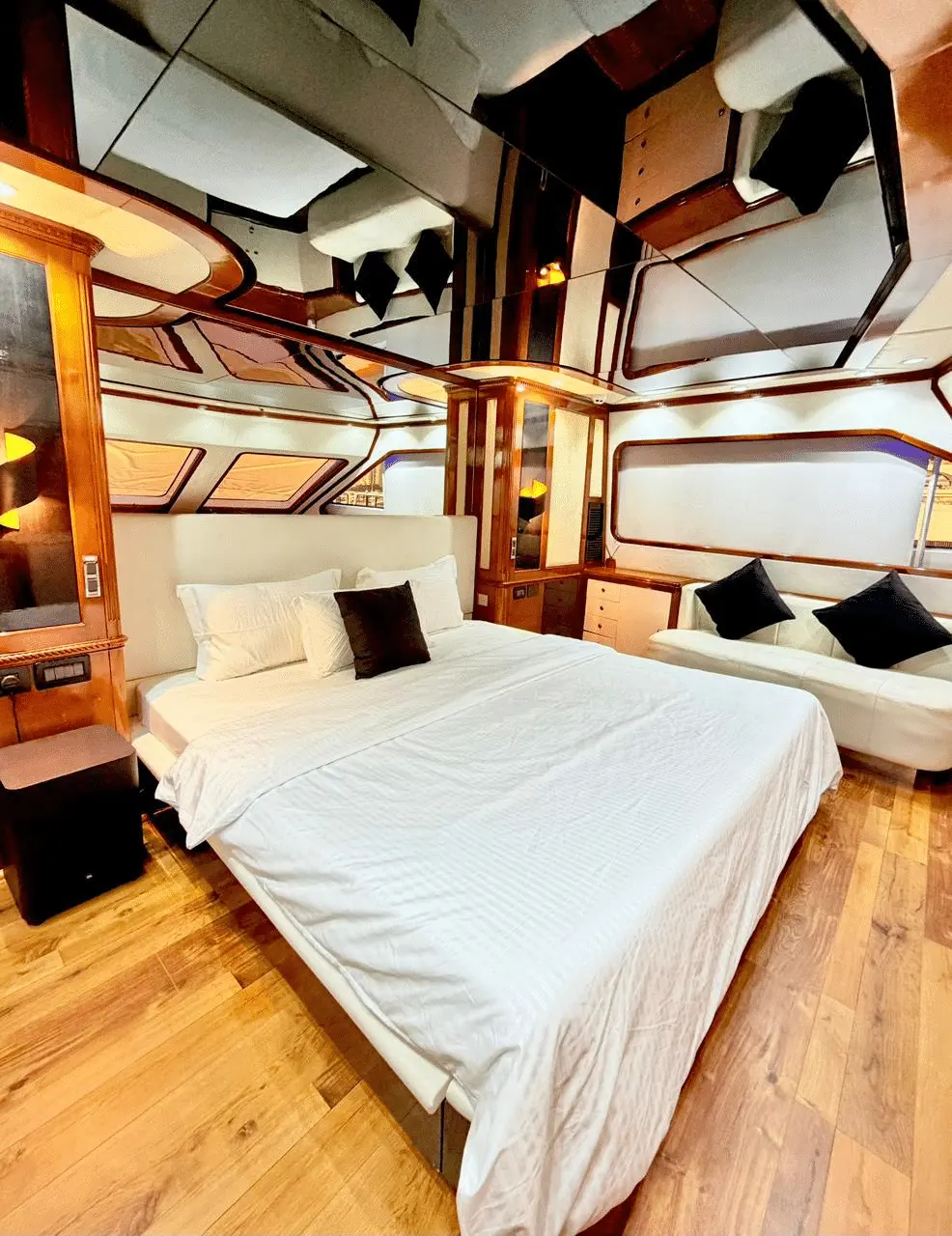 Benetti 120 VIP guest cabin with modern wood interior and ensuite layout