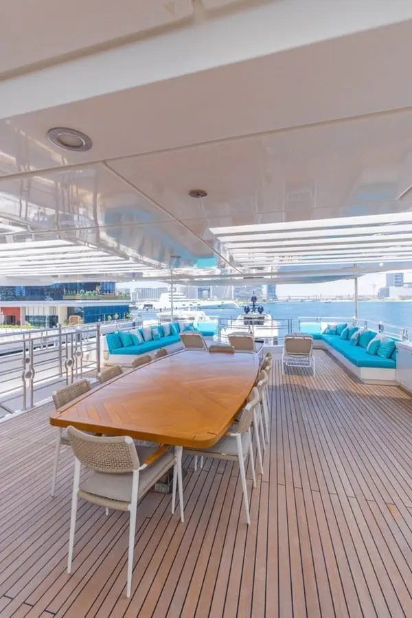Majesty 155 upper deck dining table under the overhang, broker photo