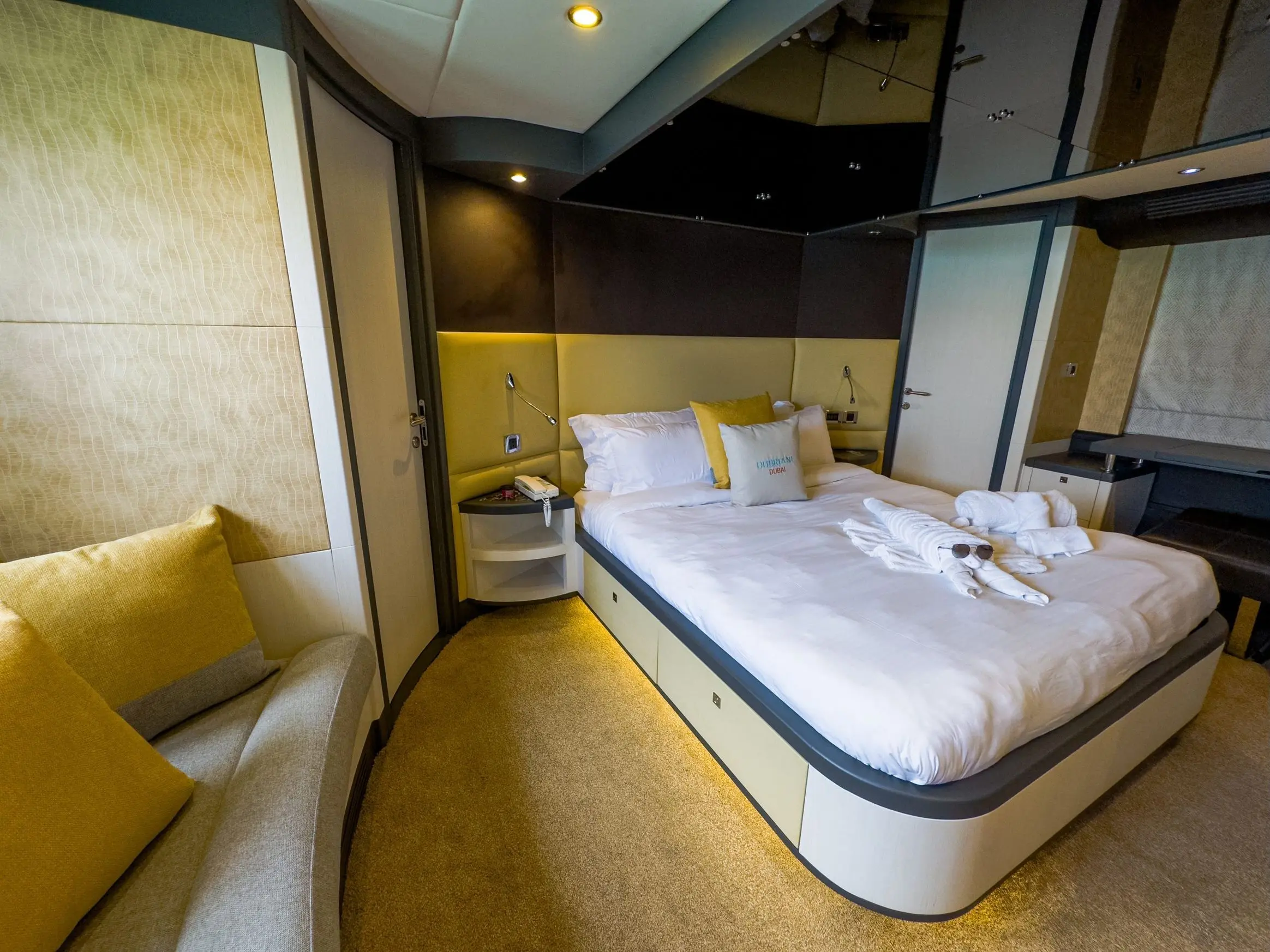 Cabo 77 yacht master bedroom cabin with modern lighting and queen bed