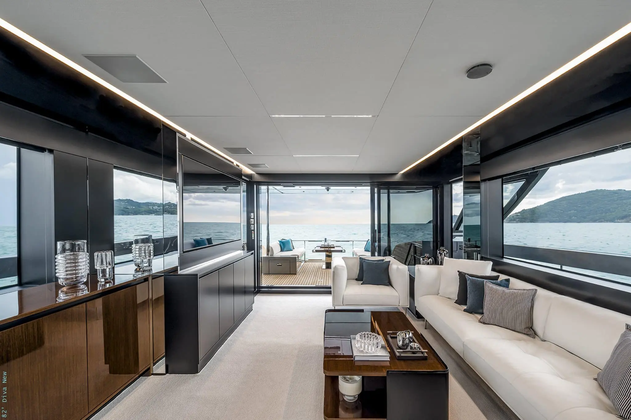 Riva 82 Diva saloon looking aft through glass doors to the cockpit