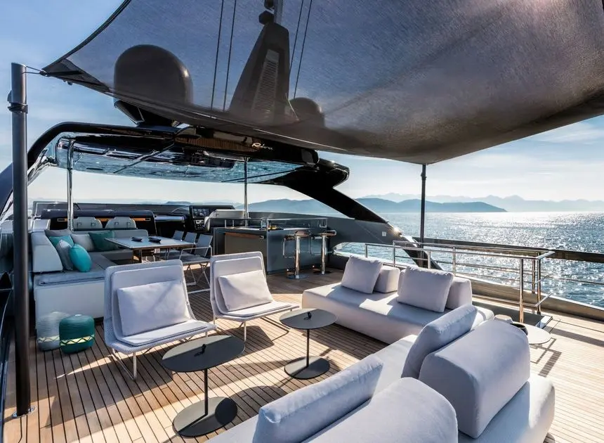 Riva 100 Corsaro flybridge lounge with bar, dining and helm views